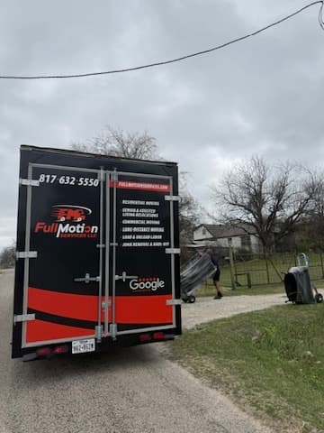 Full Motion Services truck on a rural highway during a long-distance move
